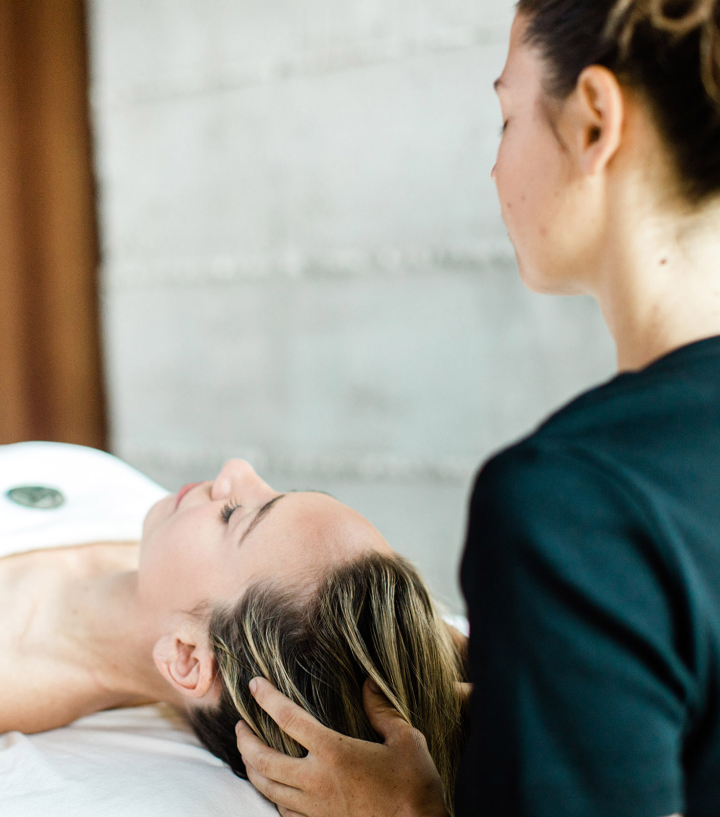 Spa therapist providing scalp massage to guest at Post Ranch Inn near Monterey, California