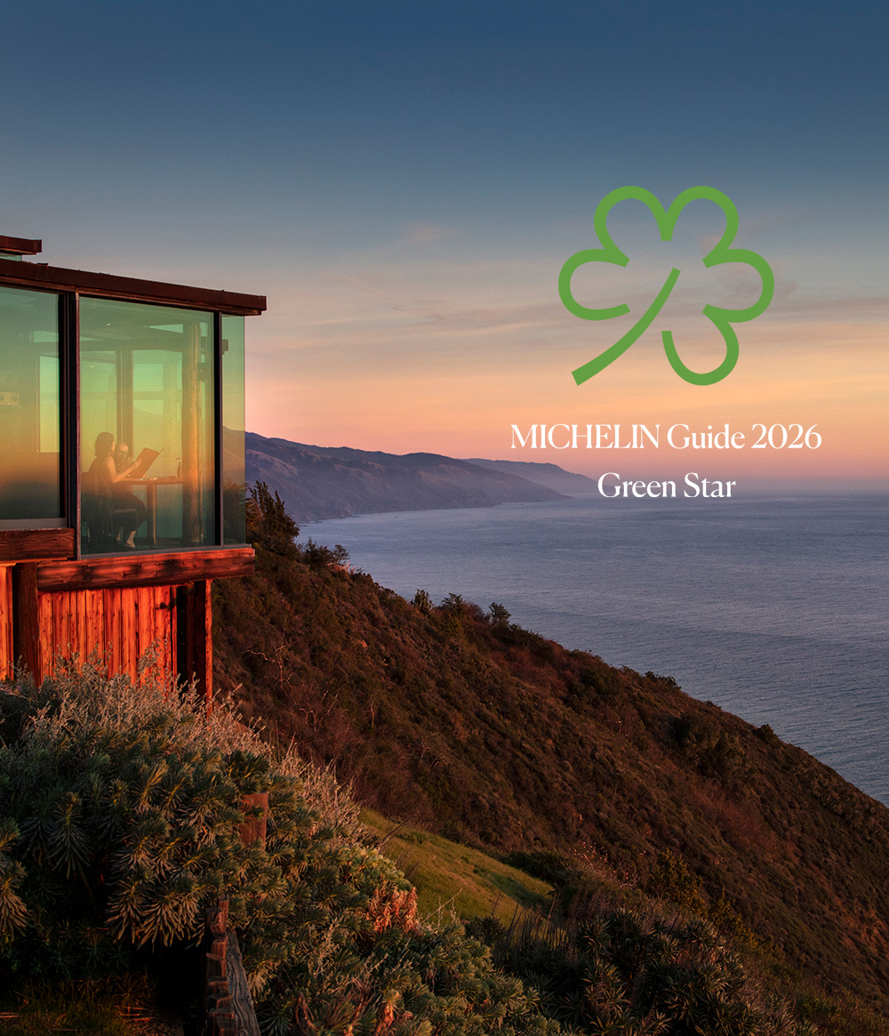 photo of Sierra Mar overlooking the ocean with a Michelin Green Star logo