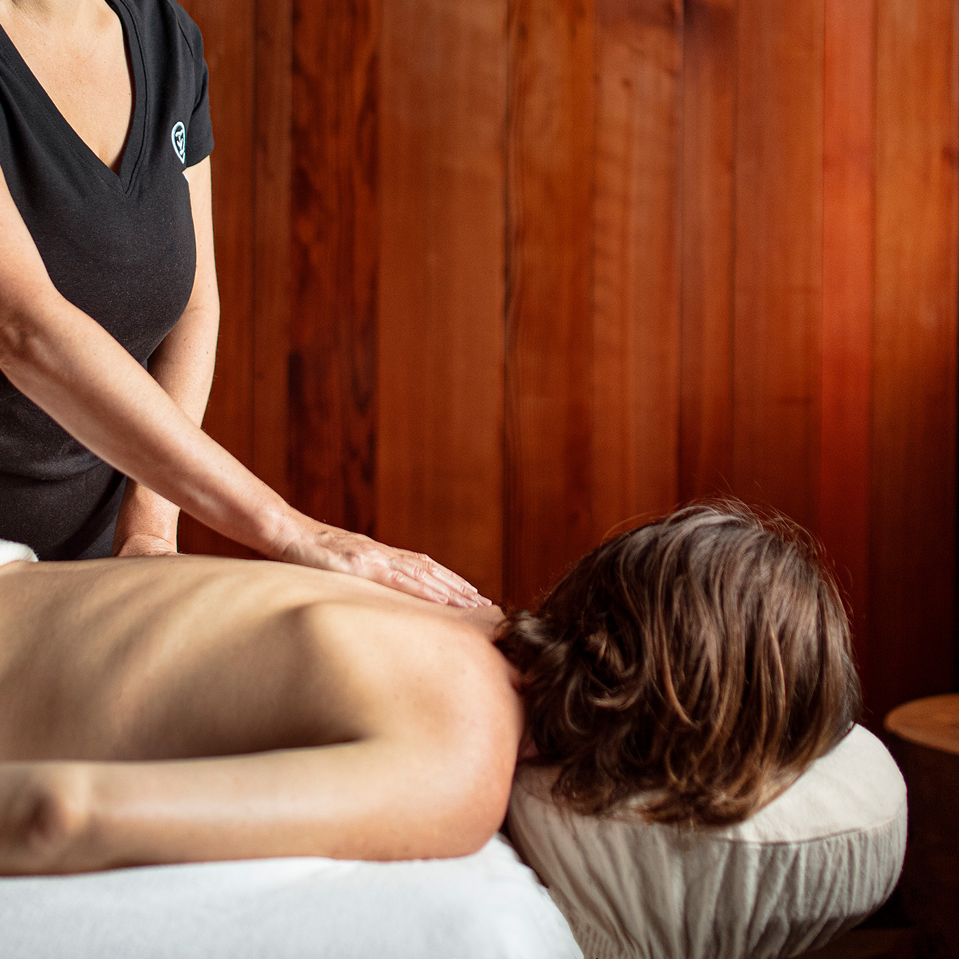 Spa therapist providing massage to guest at Post Ranch Inn in Big Sur, California
